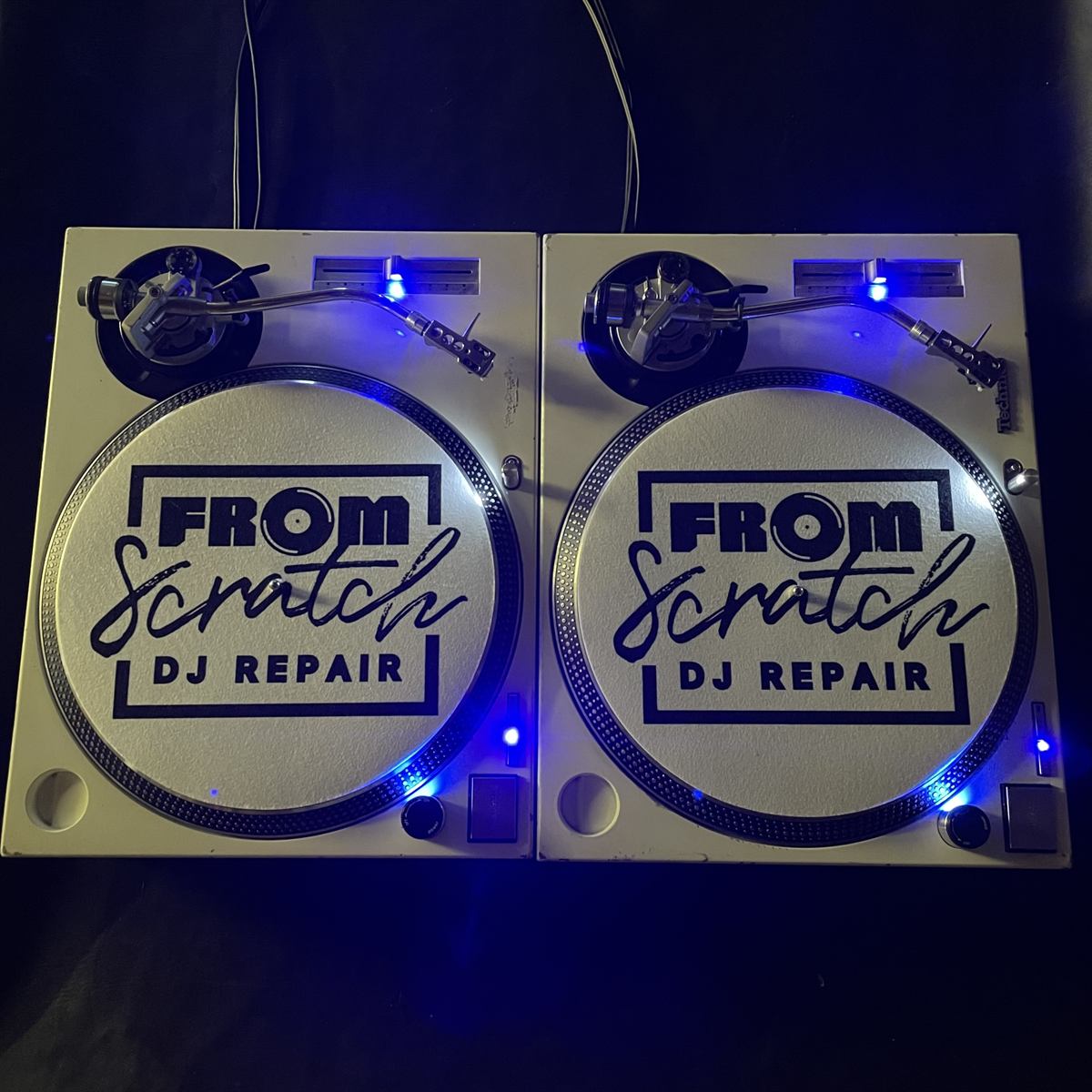 From Scratch DJ Repair branded slipmats with blue LED lighting