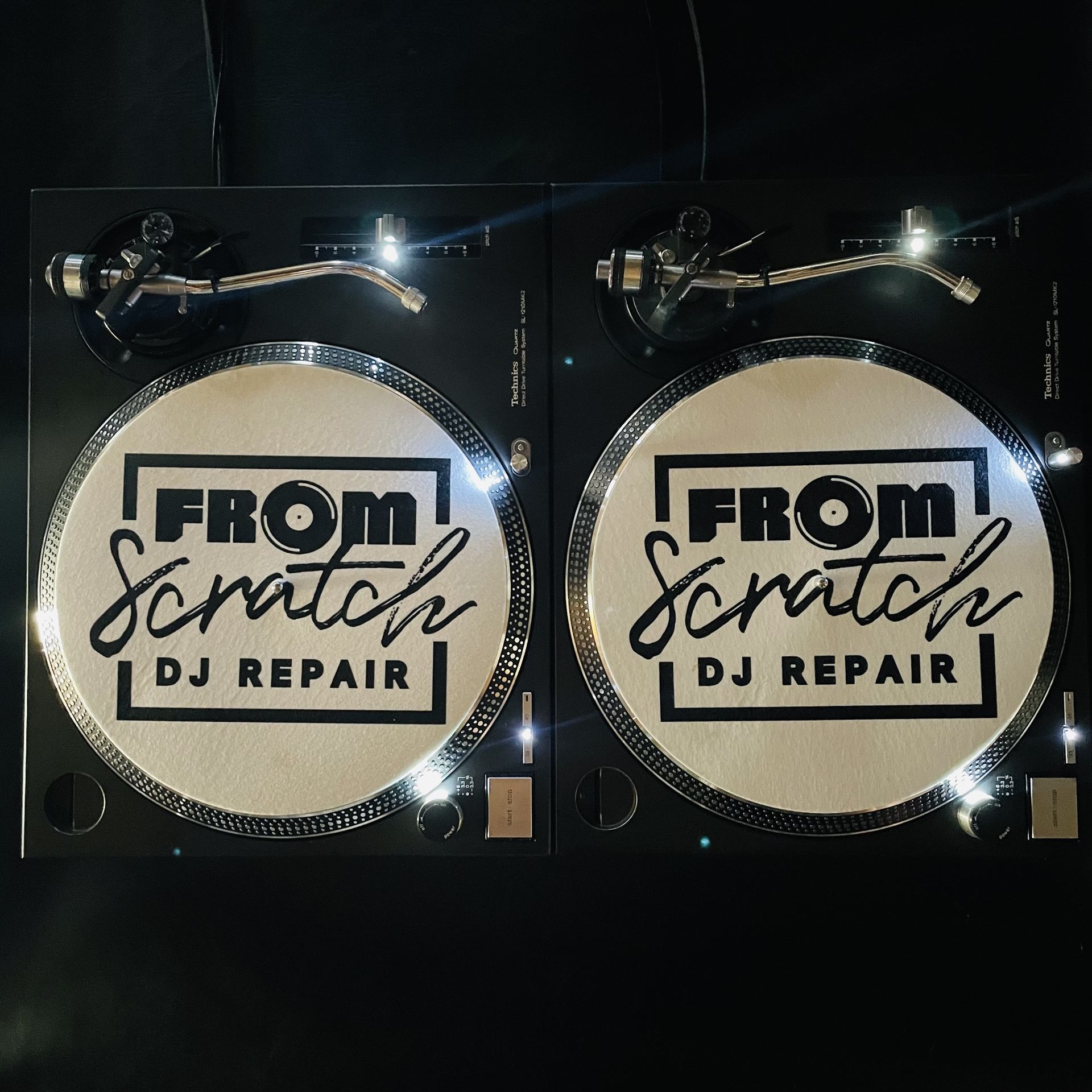 From Scratch DJ Repair branded slipmats on Technics turntables